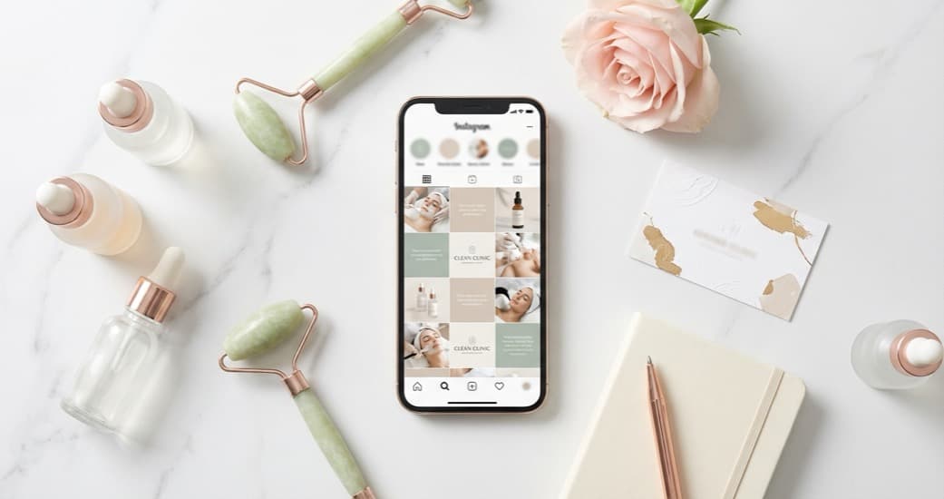 Aesthetics clinic social media flat lay with phone showing Instagram, treatment products, and branded materials