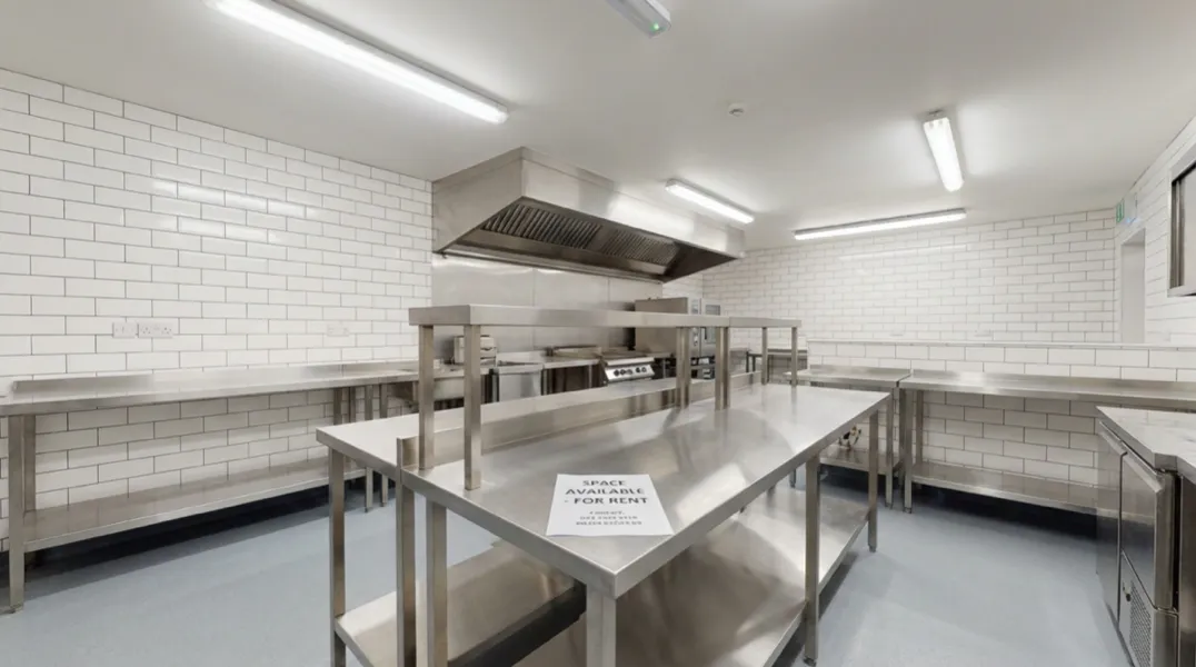 Commercial ghost kitchen for rent in a UK facility with stainless steel equipment